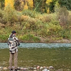 man fly fishing